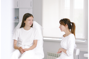 dermatologist discussing with patient